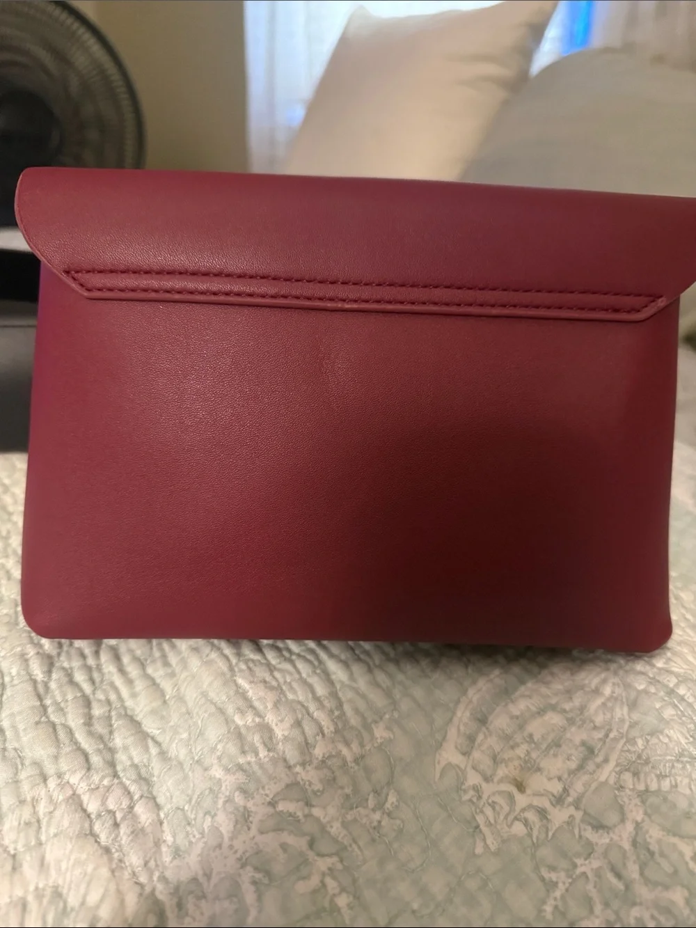 Source Unknown sleek burgundy